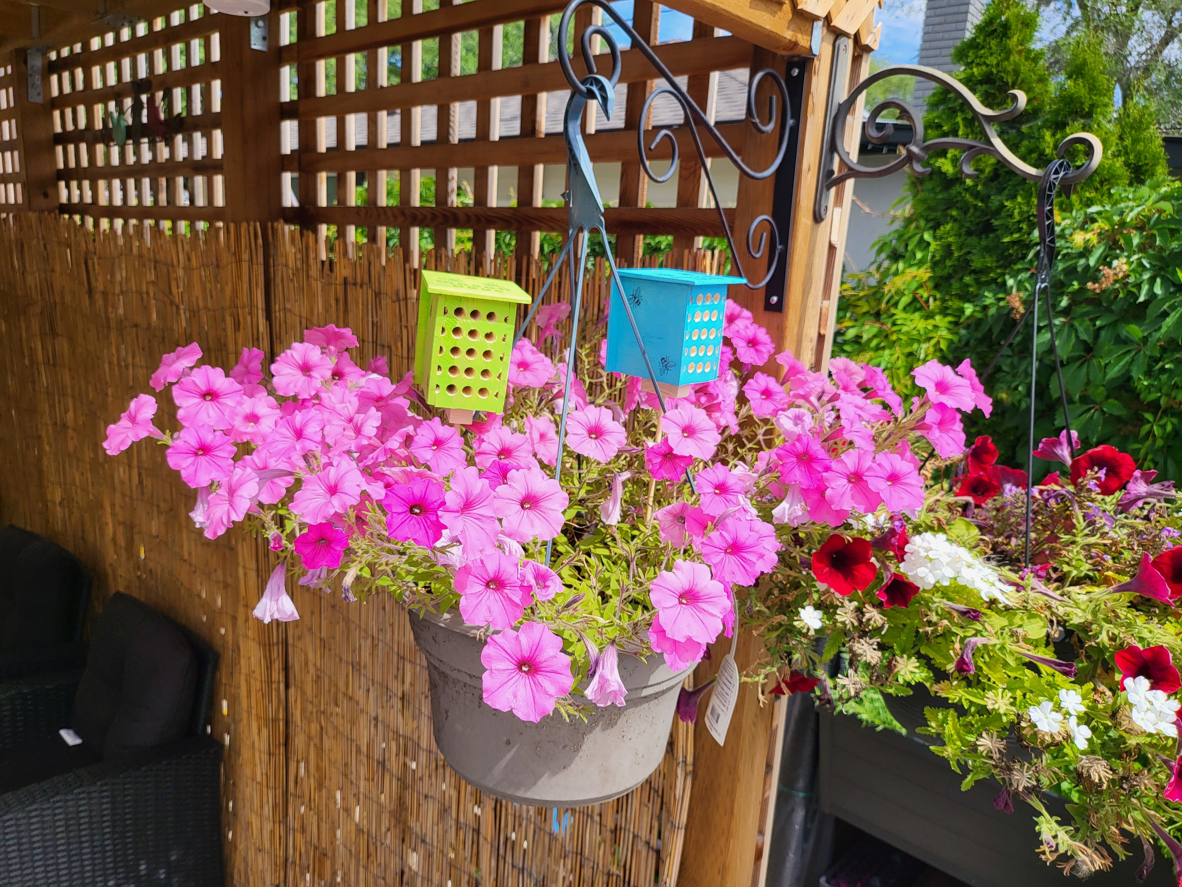 100% handmade in Canada. Every nesting hole is manually drilled for bee safety. Hand-stamped and painted 4-pack pollinator set. Premium garden art.